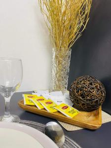 a table with a plate of food and a glass of wine at Studio 7 in Manila +4 photos