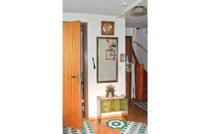 a hallway with a mirror and a table in a room at Holiday Home Graninge Boviken Töcksfors in Navarsviken