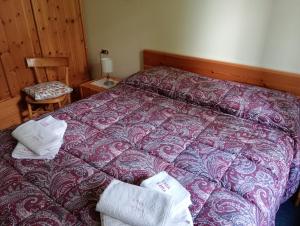 Postel nebo postele na pokoji v ubytování CASA ILARIA