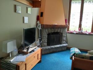 TV a/nebo společenská místnost v ubytování CASA ILARIA