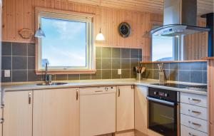 Kuchyň nebo kuchyňský kout v ubytování Holiday Home Bjergehusvej