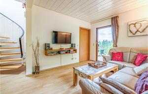 a living room with a couch and a table at Ferienhaus 12 In Kirchheim in Kirchheim