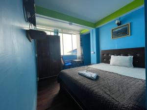Postel nebo postele na pokoji v ubytování ZORBA HOMESTAY DARJEELING