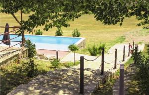 a swimming pool in the middle of a field at 4 Bedroom Cozy Home In Otok in Otok