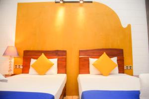 Postel nebo postele na pokoji v ubytování Royal Tusker Hotel + 37 fotografií