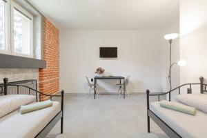 Televízia a/alebo spoločenská miestnosť v ubytovaní Hostel na Šalamouně