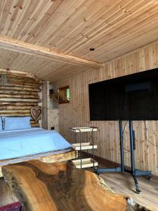 Letto o letti in una camera di DAJTI PARADISE RESORT