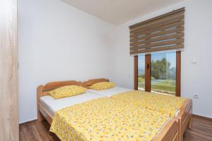 Postel nebo postele na pokoji v ubytování Jasen Apartments Lakeview