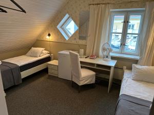 Postel nebo postele na pokoji v ubytování Vanalinna Boutique Hotel