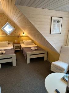 Postel nebo postele na pokoji v ubytování Vanalinna Boutique Hotel