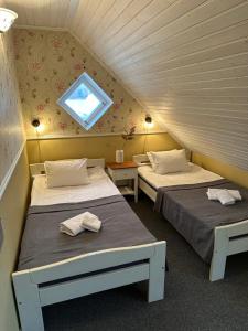Postel nebo postele na pokoji v ubytování Vanalinna Boutique Hotel