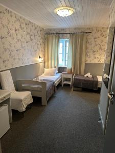 Postel nebo postele na pokoji v ubytování Vanalinna Boutique Hotel