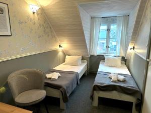 Postel nebo postele na pokoji v ubytování Vanalinna Boutique Hotel