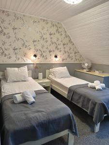 Postel nebo postele na pokoji v ubytování Vanalinna Boutique Hotel