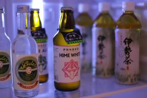 a group of bottles of beer sitting on a counter at ぽつぽつあん in Ise