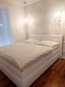 Posteľ alebo postele v izbe v ubytovaní Vila Martina + 32 fotografií