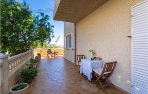 a patio with a table and chairs on a balcony at Cala Morlanda Palma D Mallorca in S'Illot +19 photos