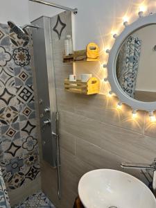 a bathroom with a sink and a mirror at SALENTO NONNI in Matino