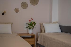 Postel nebo postele na pokoji v ubytování Theano Hotel