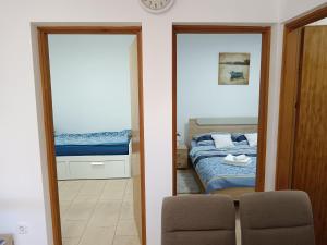 Postel nebo postele na pokoji v ubytování Apartman Pajo