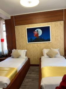 Postel nebo postele na pokoji v ubytování Abaት Guest House