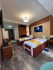 Postel nebo postele na pokoji v ubytování Abaት Guest House