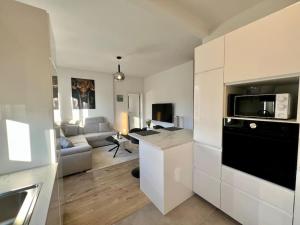 Kuchyň nebo kuchyňský kout v ubytování Modern Business Flat - Courts et moyens séjours