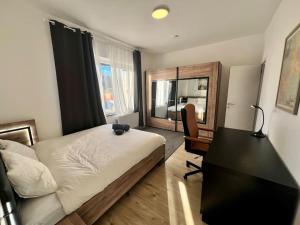 Postel nebo postele na pokoji v ubytování Modern Business Flat - Courts et moyens séjours
