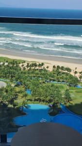 an aerial view of a beach with palm trees and a resort at Bai Dai Resort near Cam Ranh Airport in Cam Ranh