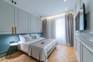 Postel nebo postele na pokoji v ubytování Villa Central + 37 fotografií
