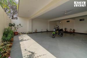 a room with two motorcycles parked in it at Serenity By The Ganges with Alfresco Dining at Varanasi by StayVista in Varanasi