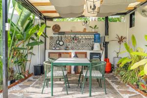 an outdoor patio with a table and chairs at Panglao Lofts in Panglao Island
