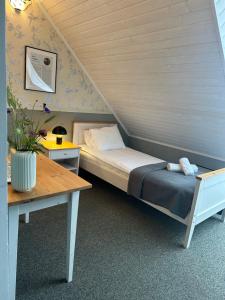 Postel nebo postele na pokoji v ubytování Vanalinna Boutique Hotel