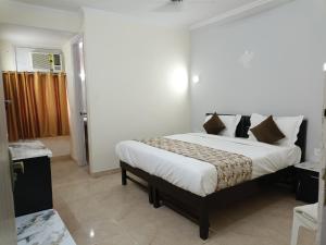 Postel nebo postele na pokoji v ubytování Airport Hotel Annexe