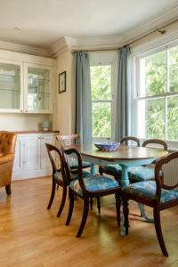 a dining room with a table and chairs at 3BR Apt 5 min to BrightonStation in Brighton & Hove