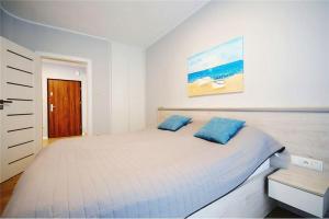 Ένα ή περισσότερα κρεβάτια σε δωμάτιο στο Apartament Silence z Tarasem Parterowy +14 φωτογραφίες