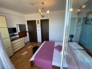 Postel nebo postele na pokoji v ubytování Vila Andreea