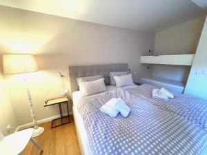 a bedroom with a bed with two pillows on it at Das Koselige Nest - perfekt für kleine Familien - nah am Bocksberg in Goslar