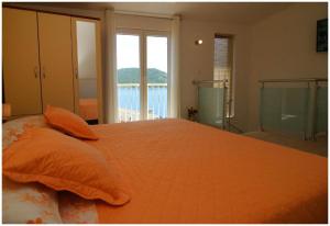 Postel nebo postele na pokoji v ubytování Apartment Karmela