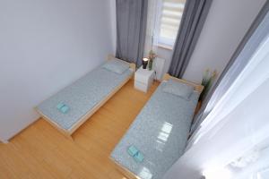 Posteľ alebo postele v izbe v ubytovaní Apartament Słoneczny 5