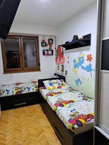 a bedroom with two twin beds in a room at Nena Apartment in Kumanovo +2 photos