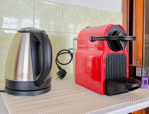 a kitchen counter with a toaster and a coffee maker at Ampio appartamento con vista in Varazze