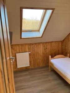 Postel nebo postele na pokoji v ubytování Gnapówka