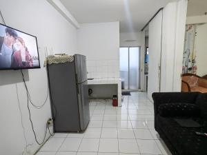 TV a/nebo společenská místnost v ubytování Mailbox Arsakha Lobi B Cibubur Village