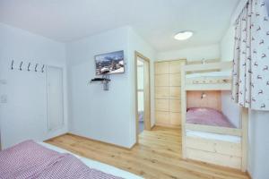 Voodi või voodid majutusasutuse Grünerstein Chalet Jungbrunnen toas
