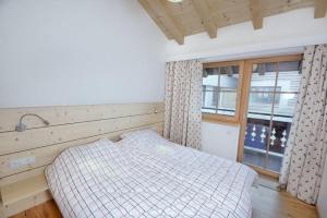 Voodi või voodid majutusasutuse Grünerstein Chalet Jungbrunnen toas