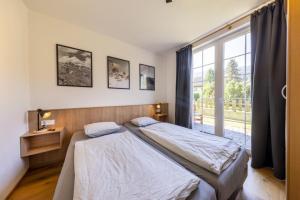 Ένα ή περισσότερα κρεβάτια σε δωμάτιο στο Haus Aineckblick Top 2