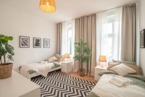 a living room with two beds and a window at Arbio Monteurzimmer Fredersdorf parking included in Altlandsberg-Süd