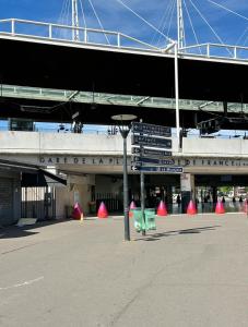 a building with a bunch of signs in front of it at Stade de France in Aubervilliers