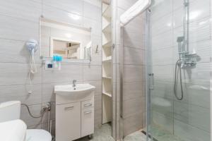 Kúpeľňa v ubytovaní Sienkiewicza Blue Apartment + 26 fotografií